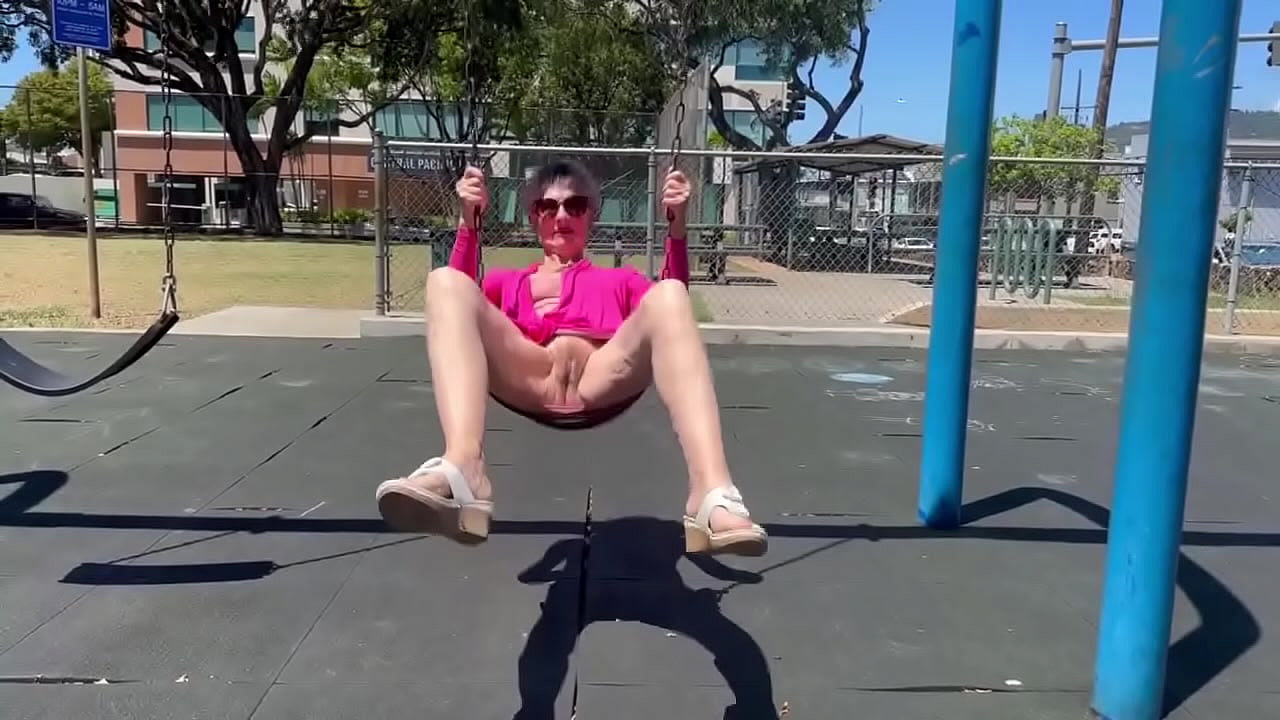 Playing on a swing in Kaimuki. (BTW, this is NOT at a school - and there was nobody nearby.)
