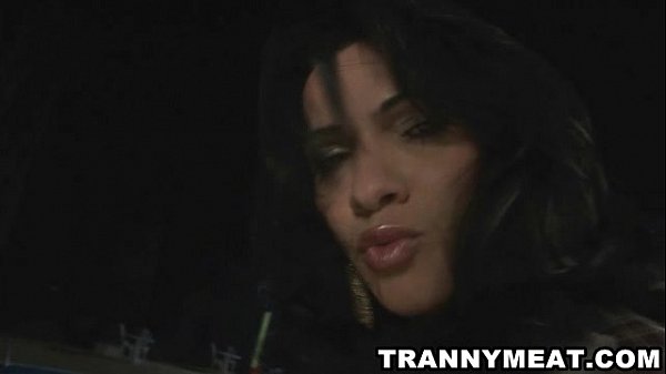 A hot brunette shemale is poolside jerking off