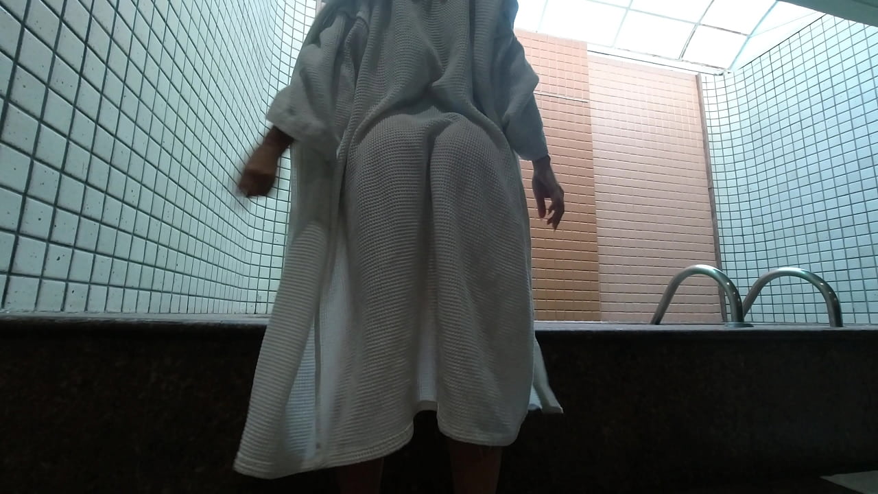 Wife bathes in the pool and sensualizes in the hot tub