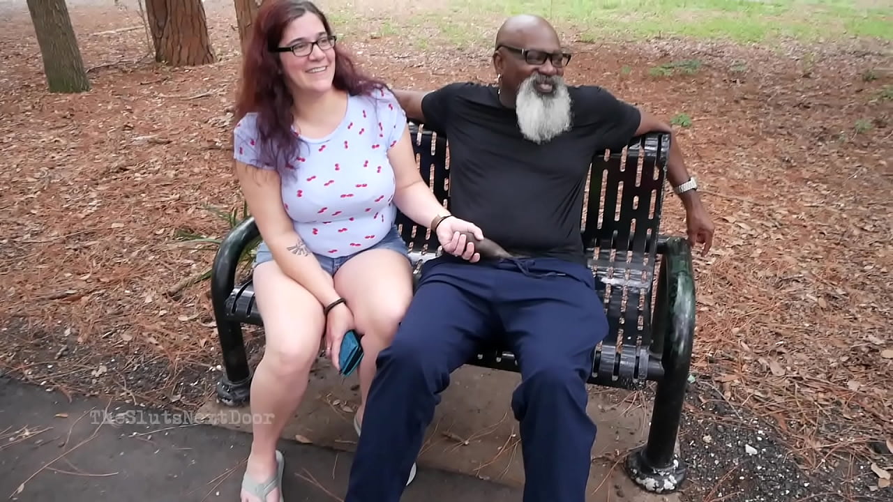 Nerdy Milf strokes and suck blk dick in the Park