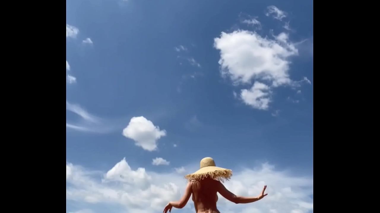 Sexy stepmother walks naked in the field