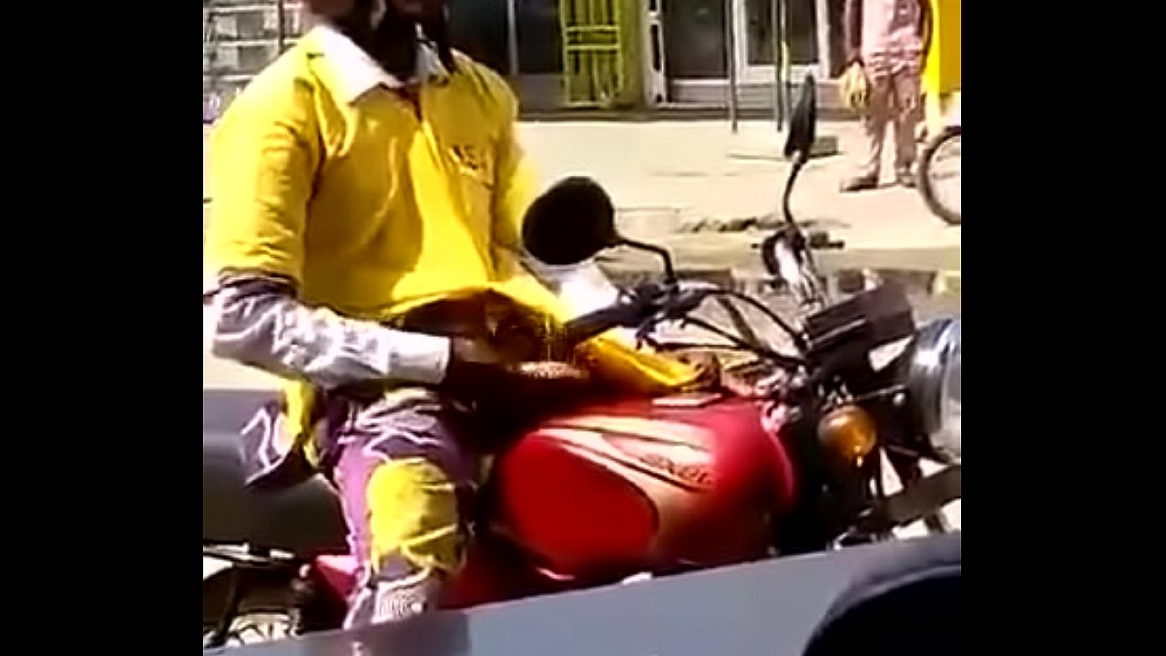 Motorbiker stroking his meat
