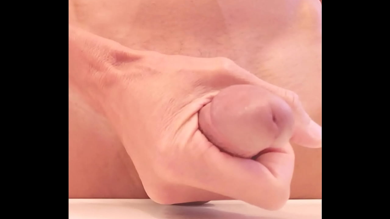 Close up of cock head being jerked