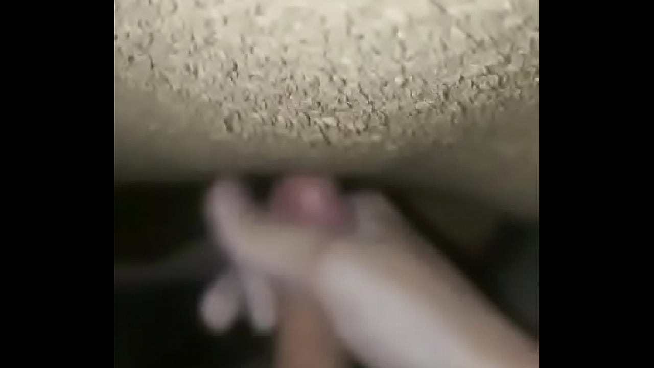 Jerking off soft penis in room