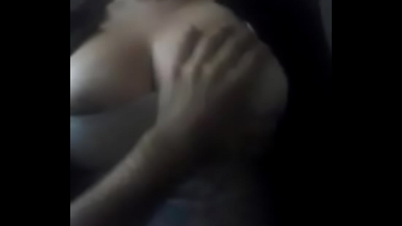 Busty woman undressing