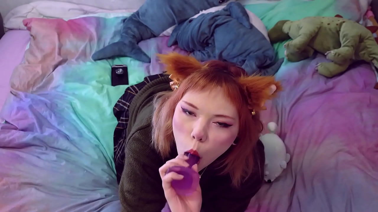 A cute fox girl pleases herself with a blowjob and penetration with a toy