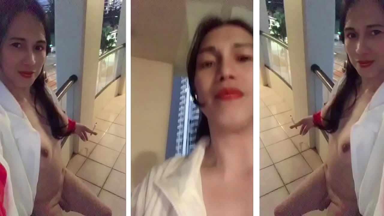 ladyboy smoking in balcony naked