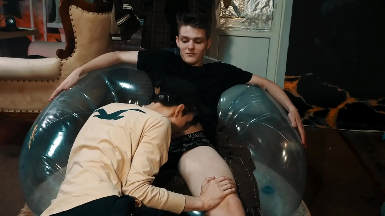 A transparent chair is tested for strength, with the help of sex by young students