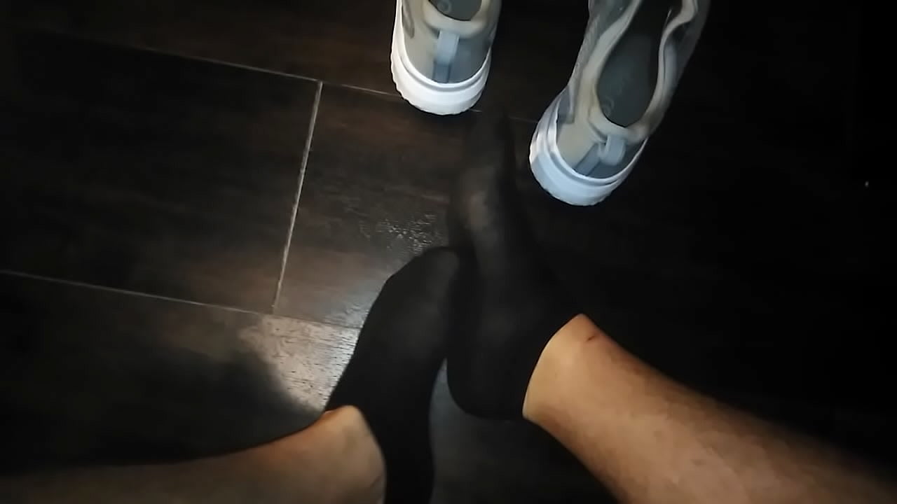 Playing and tickling my socked feet.