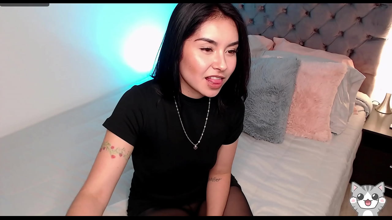 Black pantyhose and sexy outfit modeling her legs and feet