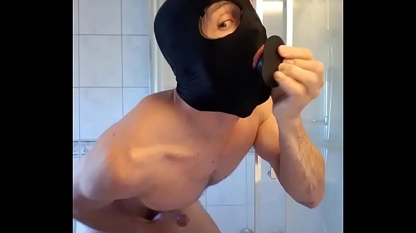 Dildo play by slave in bathroom