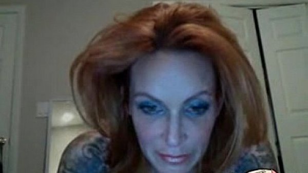 Hot redhead MILF with saggy tits plays with her pussy