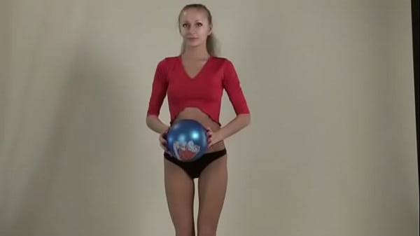 Teen stretches her legs and body showing huge tits