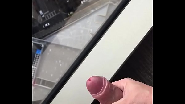 Me wanking with big cumshot over hotel room window, during daylight