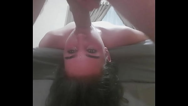 Fucking a whore's throat while she is lying upside down