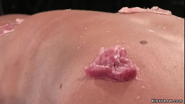 Gagged brunette slave Cecilia Vega is bound to wooden post and gets pussy vibrated then laid in wooden stock gets waxed and caned on device bondage 