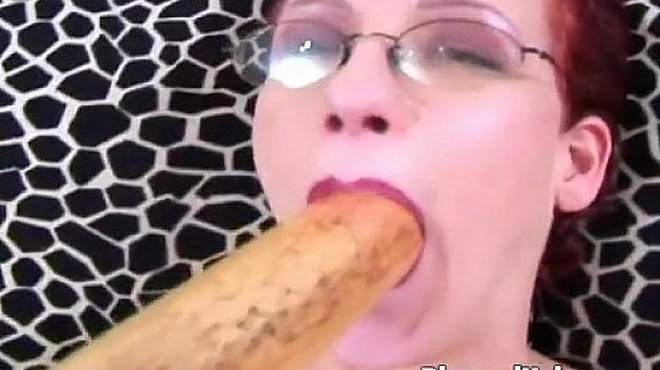 Redhead puts dildo deep inside her cunt