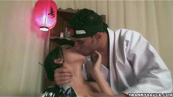 Yummy brunette shemale babe sucking on a cock