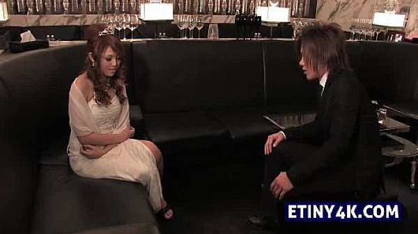 Asian sexy bride teasing a guest from wedding