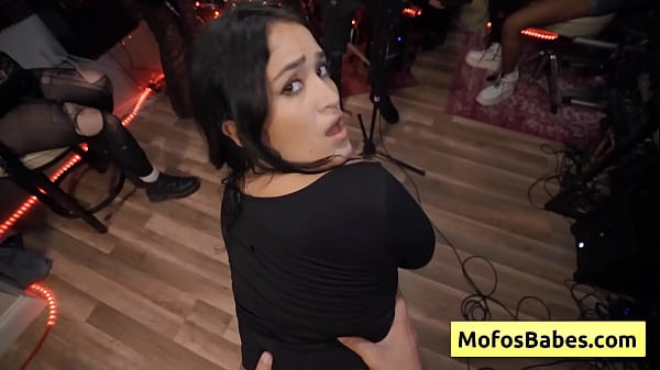 See this black haired slutty girl seducing band dude with her natural big tits