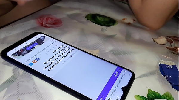 Touches her boobs on the phone screen  