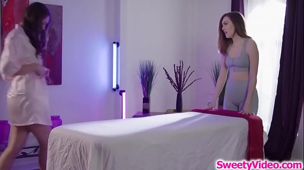SweetyVideo.com - A teen masseuse proves their lesbian regular client that she can perform well.The big tits babe lies on the table while she licks her hairy pussy.