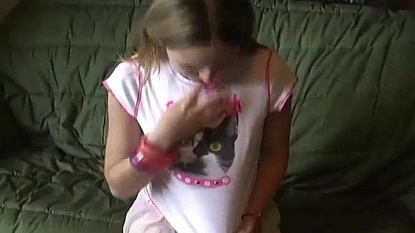 Petite teen Kitty flashing her panties in a tiny miniskirt  