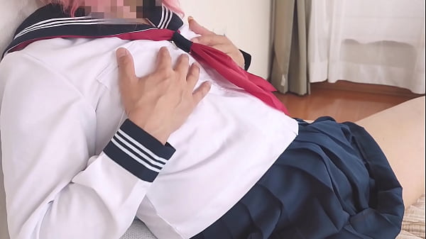 Kotchan cross-dresses in school's white sailor uniform and caresses her anal and prostate with a double-headed dildo.