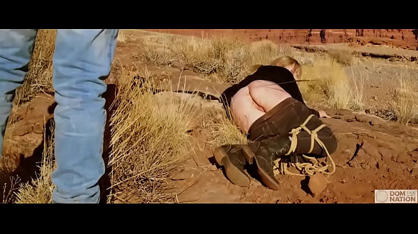 Submissive babe gets an asshole whipping before getting butt fucked on pee-covered ground -- a hard, genuine domination adventure out in nature (Rebel Rhyder)  