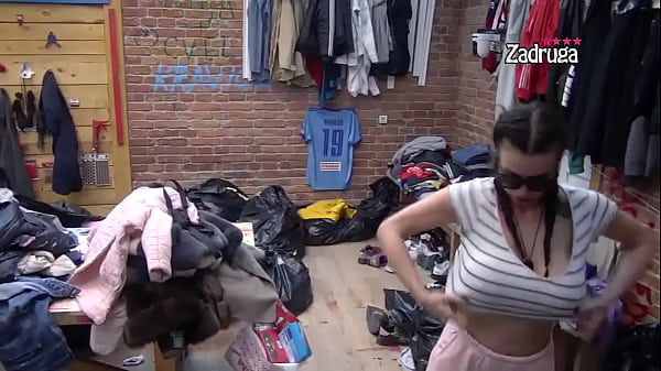 Brunette shows her big tits in a reality show