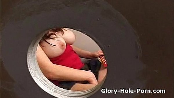 Plumb bigtit slut in public restroom rubs pussy and blows dick through gloryhole