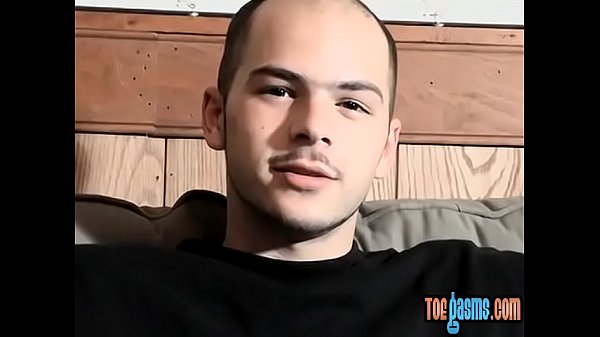 Foot fetish young man tugging it off