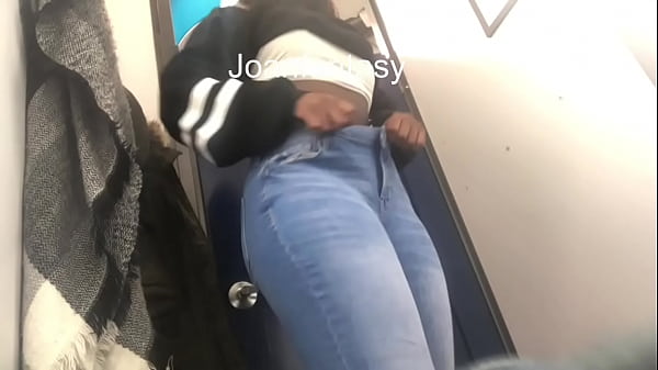 Having some fun while trying on jeans in a change room