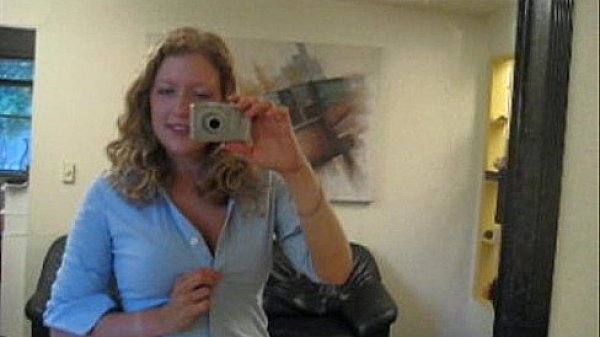 Busty girl next door Andy Lynn takes picture of herself in the mirror