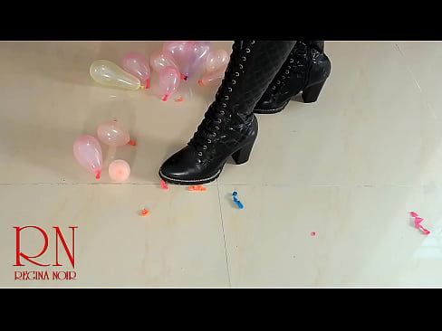 Small balloons pop with high heels boots. FULL