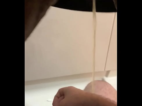Peeing on his dick