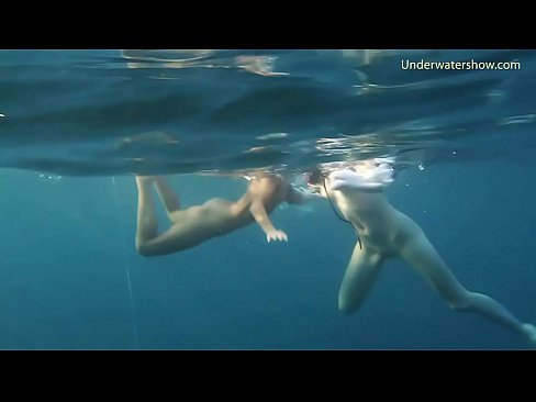 Underwater in the sea young babes swimming nude
