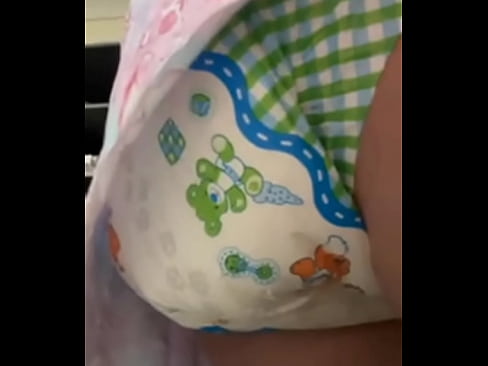 Diaper girl fills nappy then squishes around