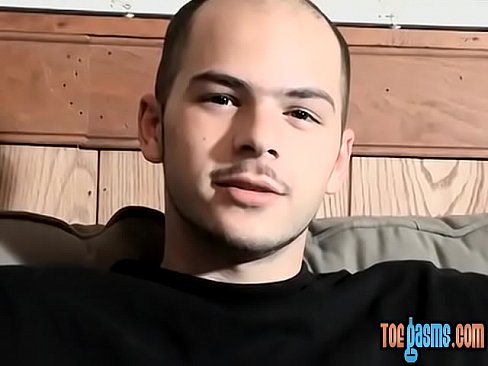 Foot fetish young man tugging it off