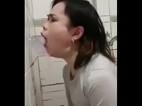 Asian girl face fucking herself with a dildo