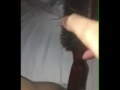 Horny slut playing with hairbrush