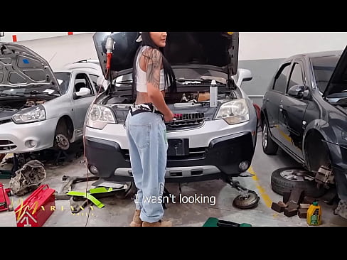 A Colombian woman working as a car mechanic seduces a porn actor to have sex in the workshop