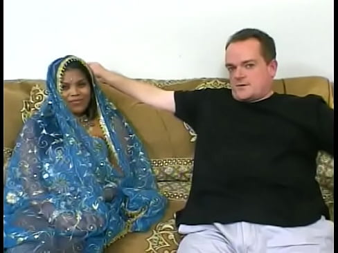 Indian princess in national dress plays with a big black dildo and then gives a blowjob to two guys