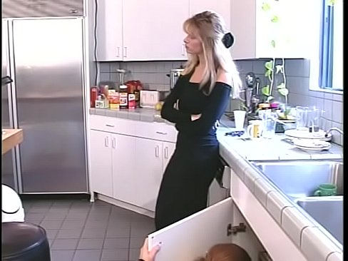 Dude bends busty stockinged blonde over kitchen counter to fuck her from behind