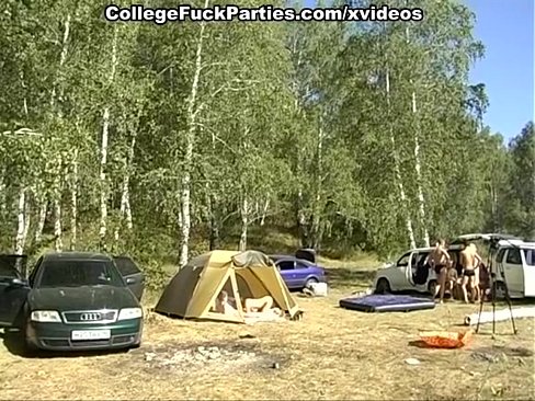Lewd couple of naked students fucking in the tent