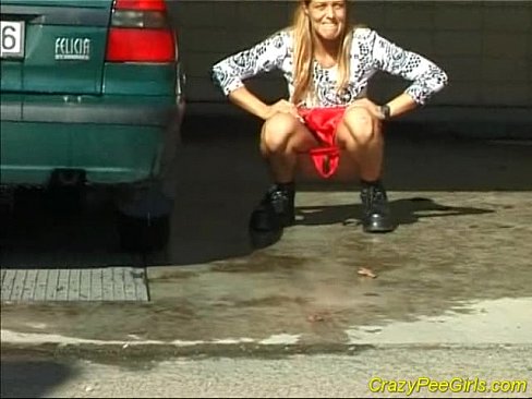 Crazy pee girl at the car wash