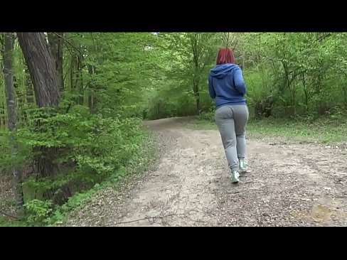 Busty fat redhead strips and plays in forest