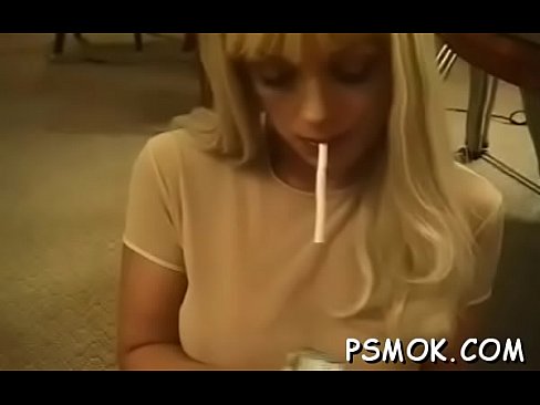 Charming babe smokes alone