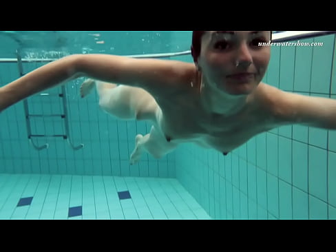 Russian girl swims nude while stripping in the pool
