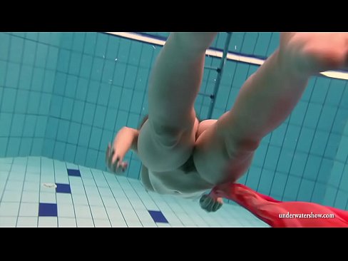 Sexy Russian slut strips in the swimming pool